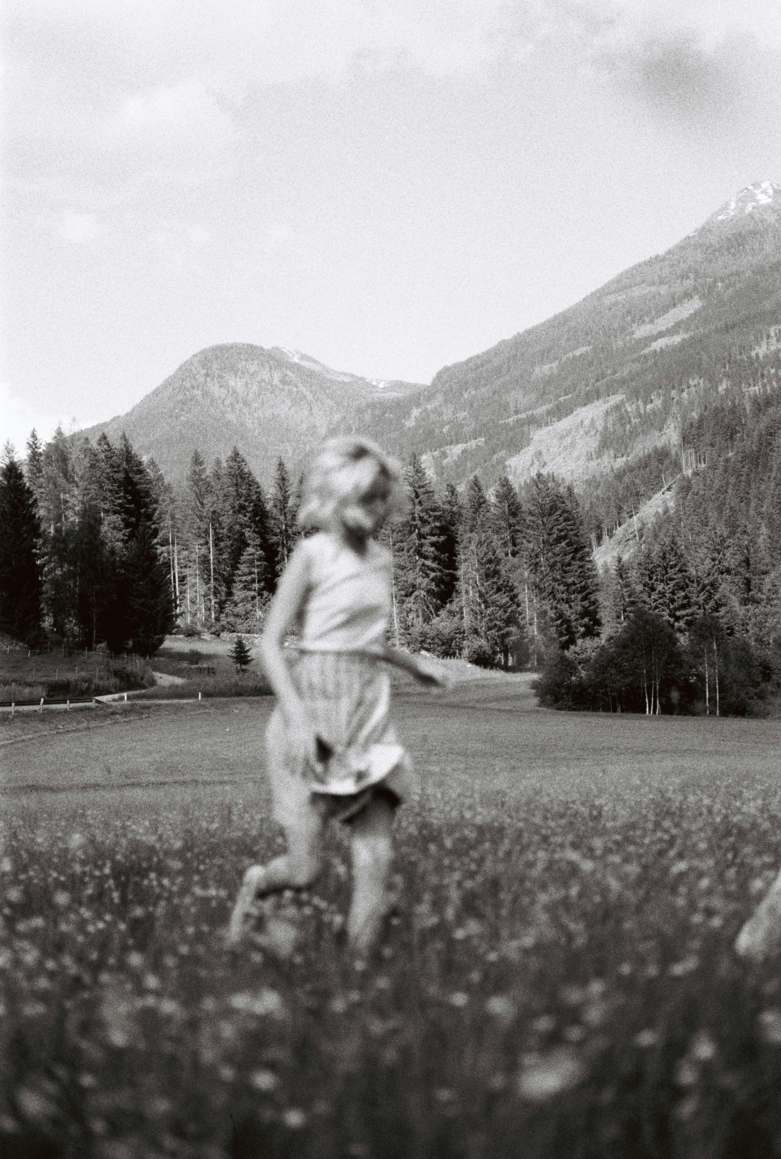 Girl Running Through Wildflowers